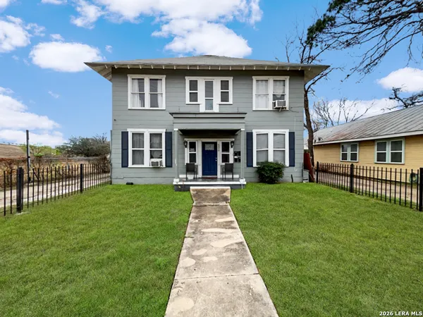 a front view of a house with yard