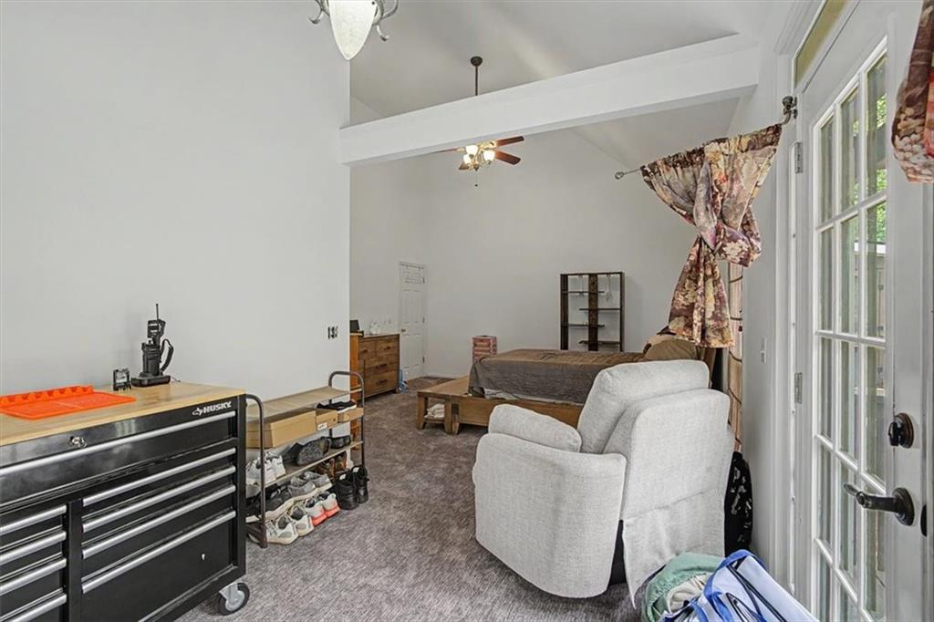 409 Windsor Way Canton, GA 30115 - Photo 16 of 51 a living room with furniture a rug and a wooden floor