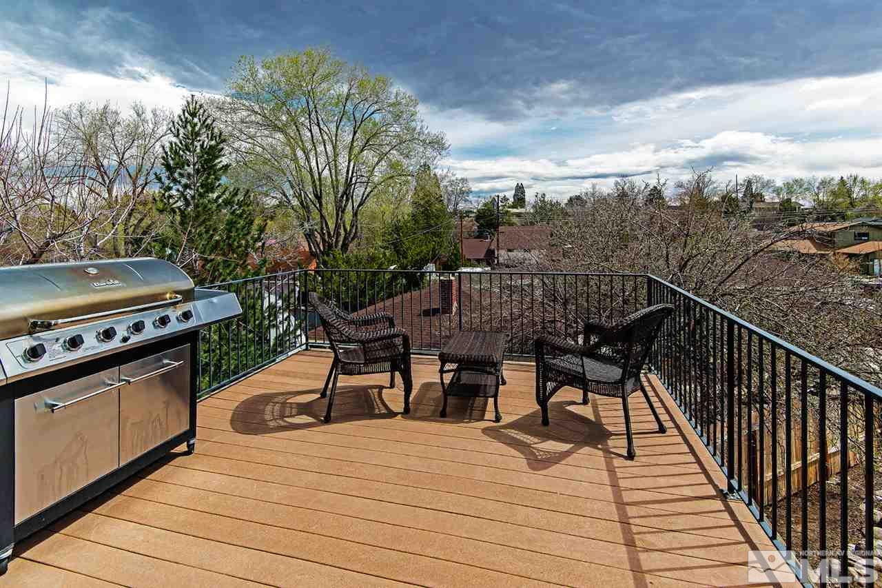 a view of a patio with wooden floor