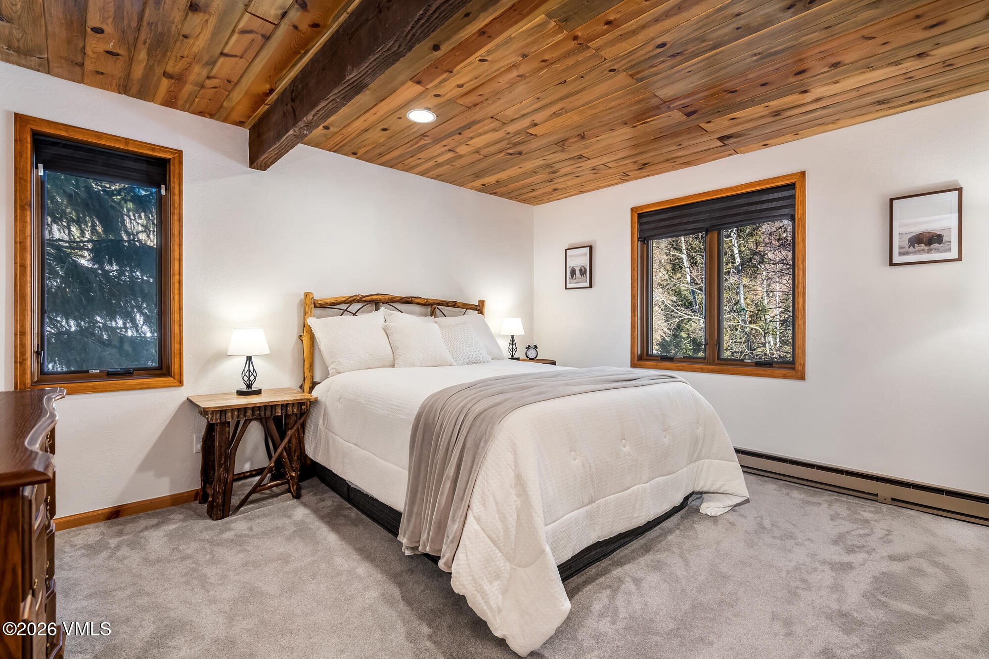 4470 Timber Falls Court, Unit 1405 Vail, CO 81657 - Photo 12 of 35 a bed sitting in a spacious bedroom next to a window