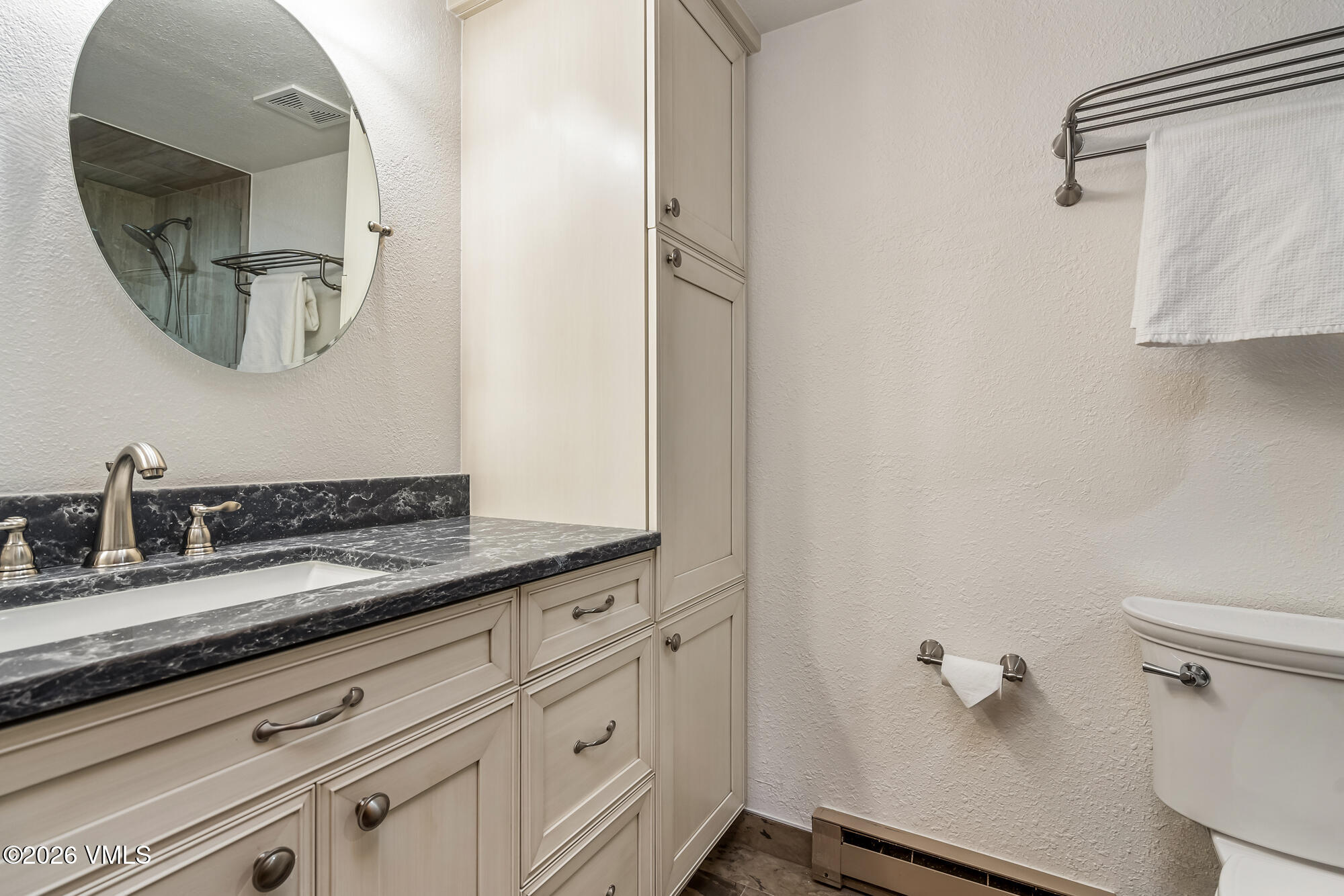 4470 Timber Falls Court, Unit 1405 Vail, CO 81657 - Photo 14 of 35 a bathroom with a granite countertop sink and a mirror