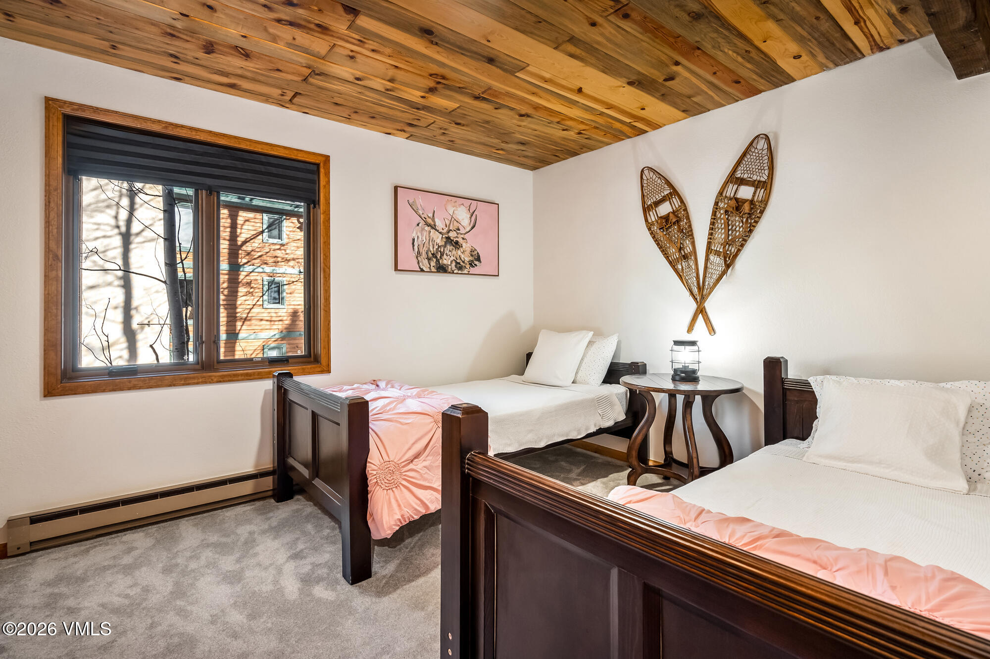 4470 Timber Falls Court, Unit 1405 Vail, CO 81657 - Photo 18 of 35 a bedroom with a bed and a window