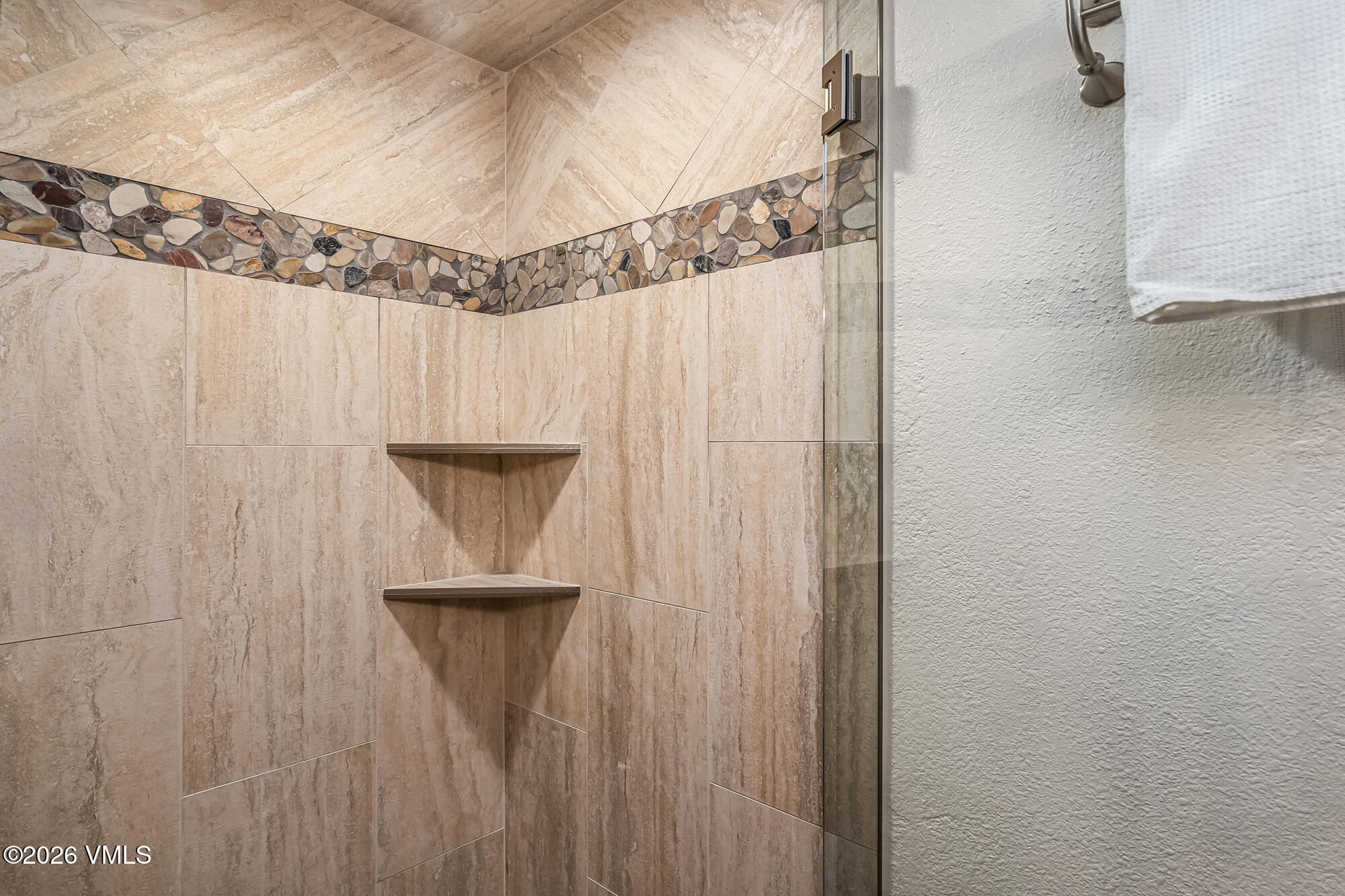 4470 Timber Falls Court, Unit 1405 Vail, CO 81657 - Photo 20 of 35 a view of a hallway with closet and chandelier fan