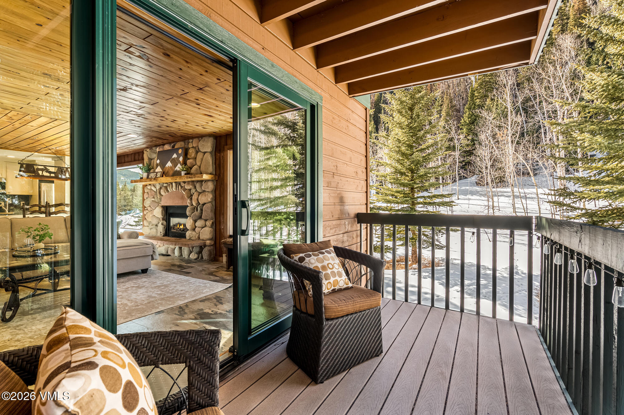 4470 Timber Falls Court, Unit 1405 Vail, CO 81657 - Photo 3 of 35 a balcony with furniture and wooden floor