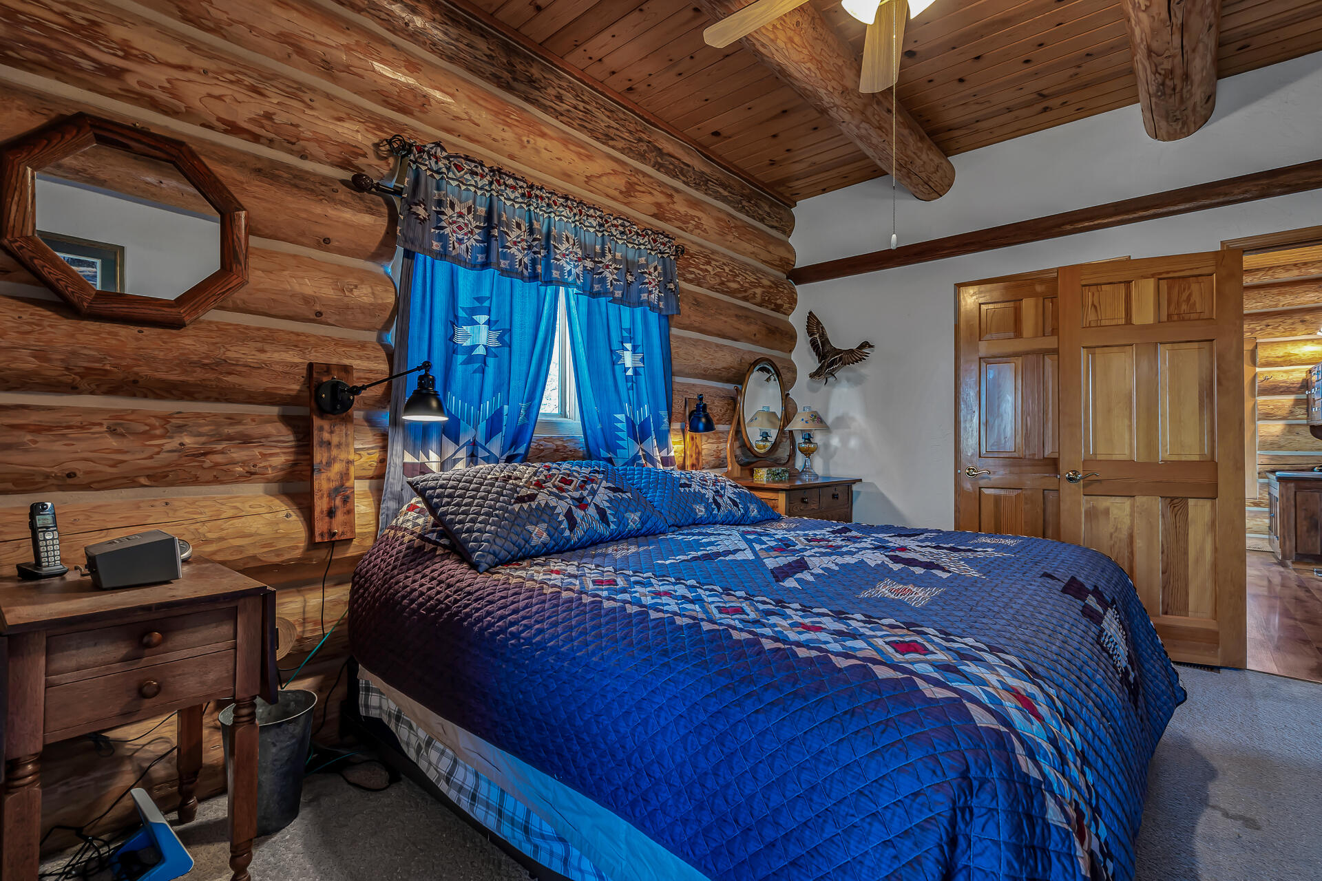 43007 Shoshoni Loop Fall River Mills, CA 96028 - Photo 43 of 87 a bed sitting in a bedroom next to a window