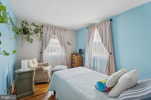 a bedroom with bed and a window