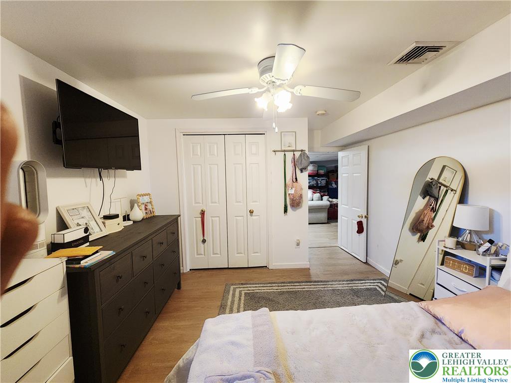 237 Ridings Circle Macungie, PA 18062 - Photo 59 of 70 Smooth wood-tone flooring runs throughout this comfortable bedroom space.