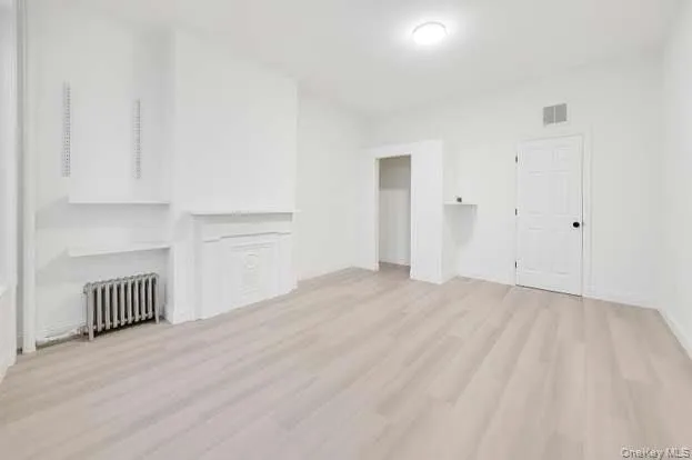 a view of an empty room and window