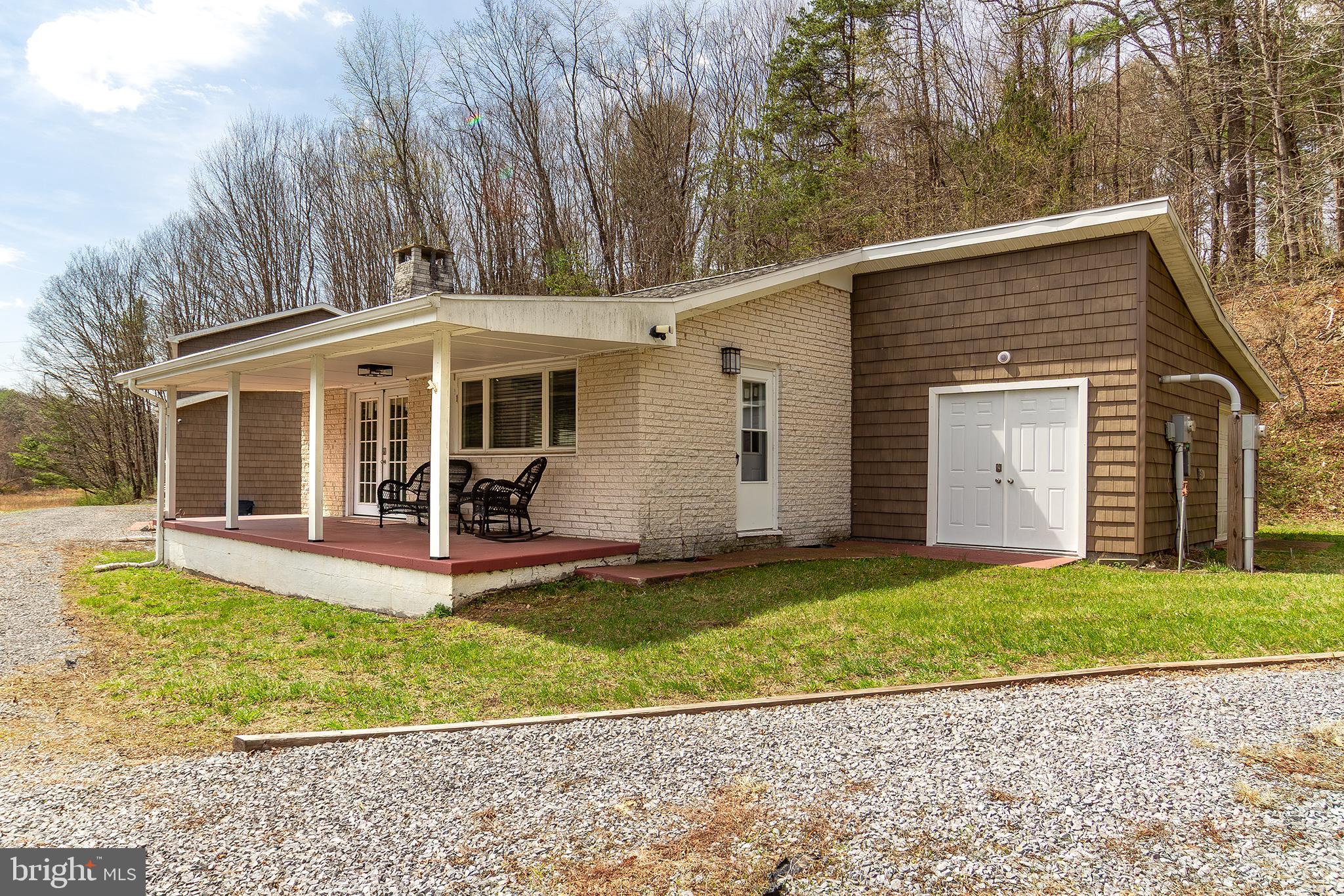11907 Colyer Lane Shade Gap, PA 17255 - Photo 44 of 87 a view of a yard in front of a house with large windows and plants