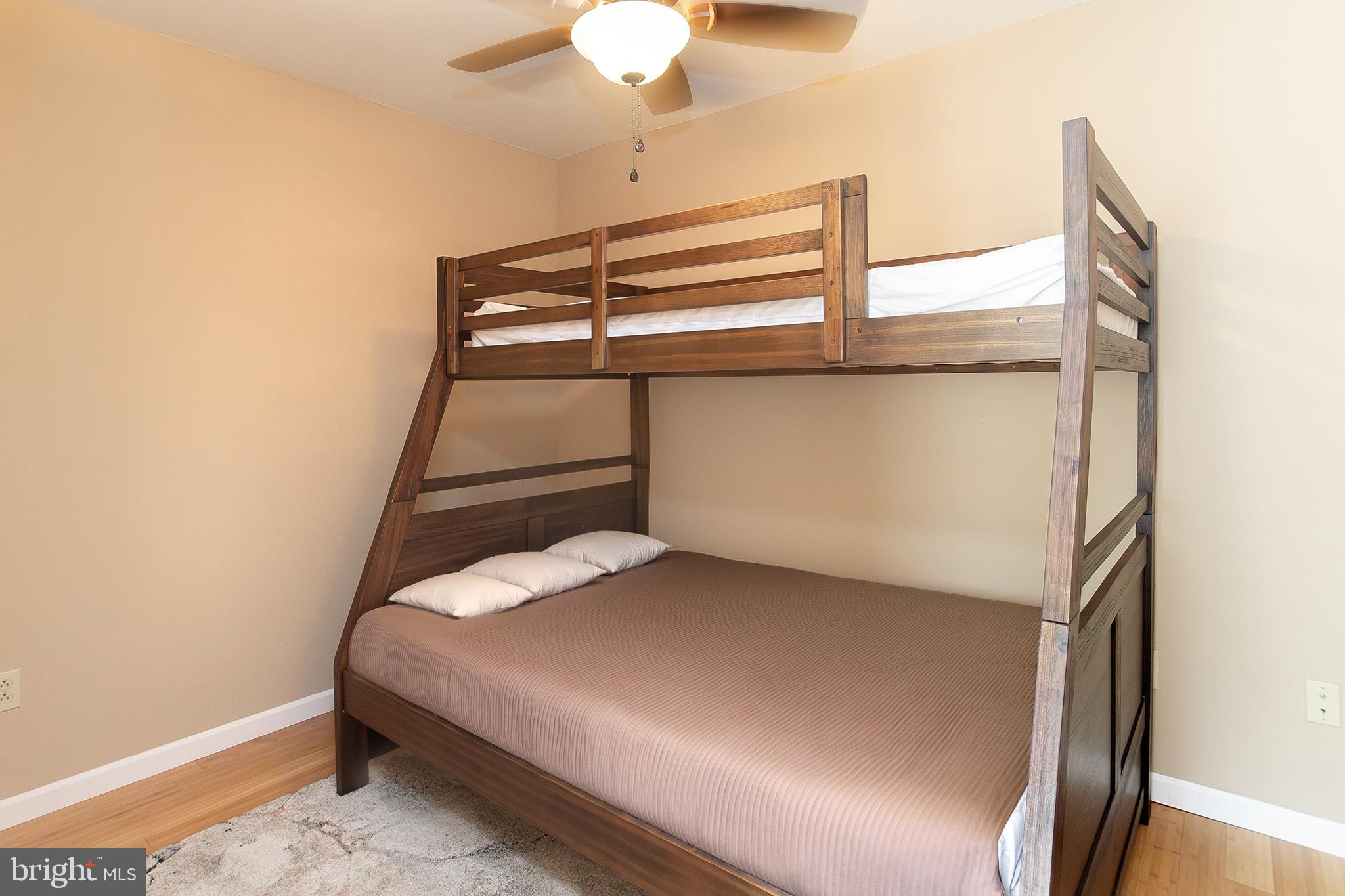 11907 Colyer Lane Shade Gap, PA 17255 - Photo 59 of 87 a bedroom with a bed and a chandelier