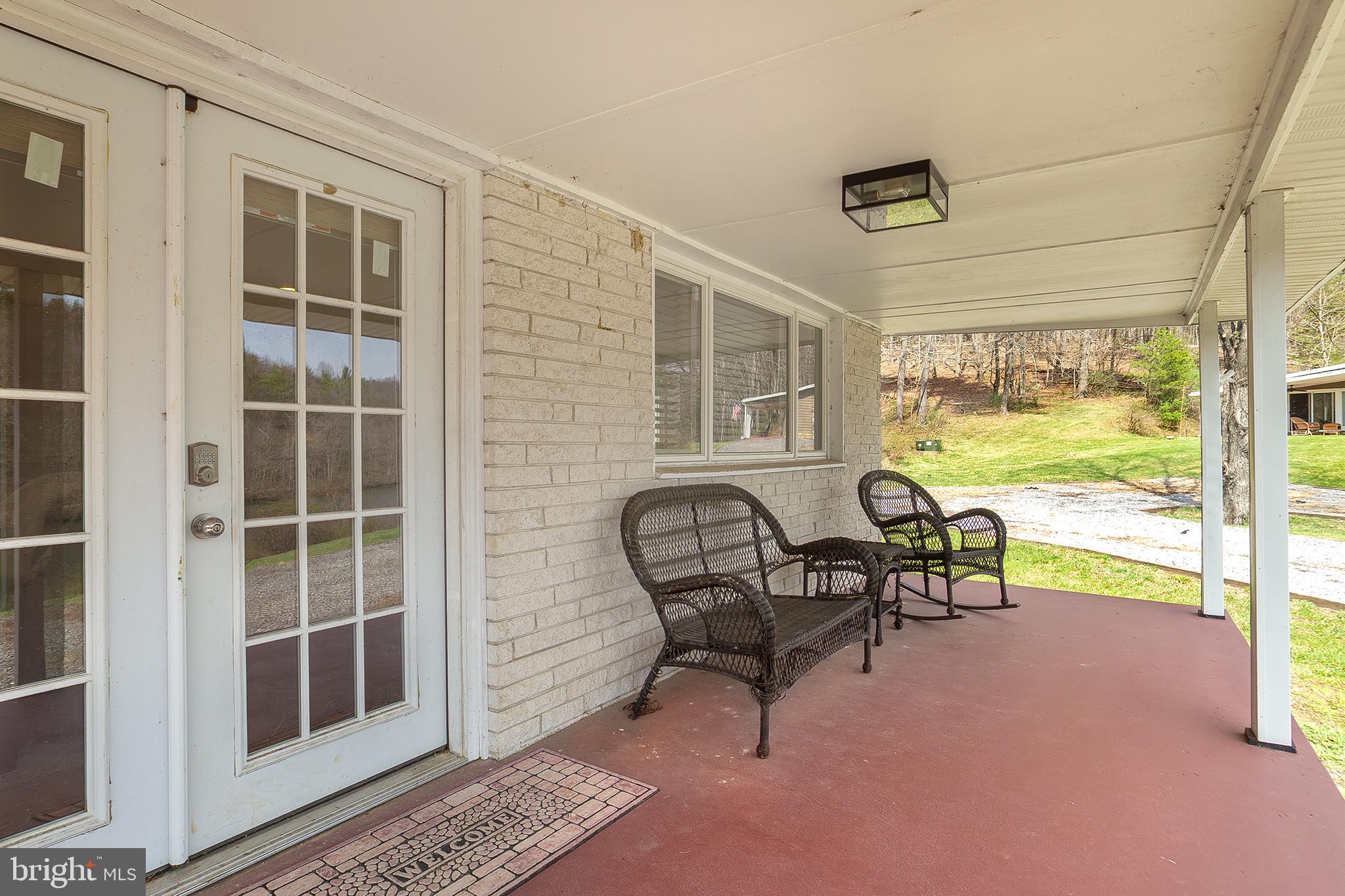 11907 Colyer Lane Shade Gap, PA 17255 - Photo 60 of 87 a living room with furniture and a floor to ceiling window