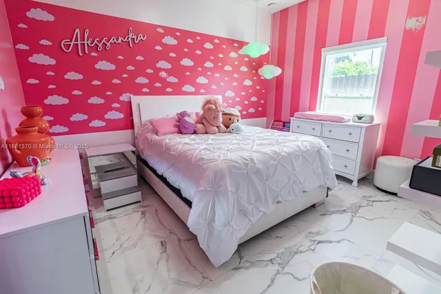 a bed room with a bed and a window