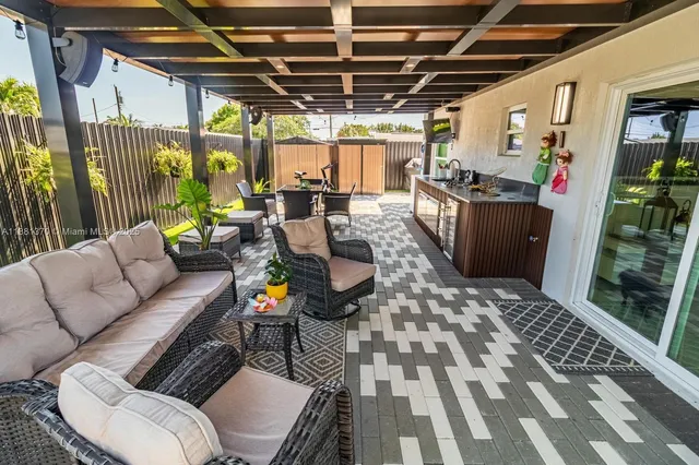 a view of swimming pool with sitting area