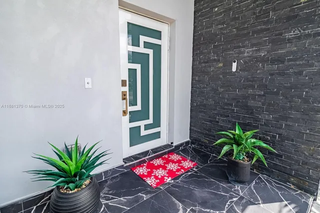a potted plant sitting in front of a house