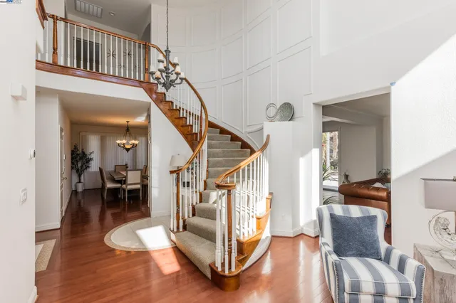 a view of entryway livingroom and hall with wooden floor