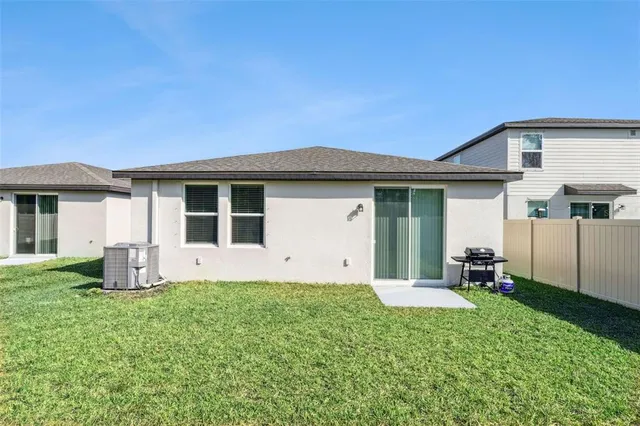 a front view of a house with a garden and yard