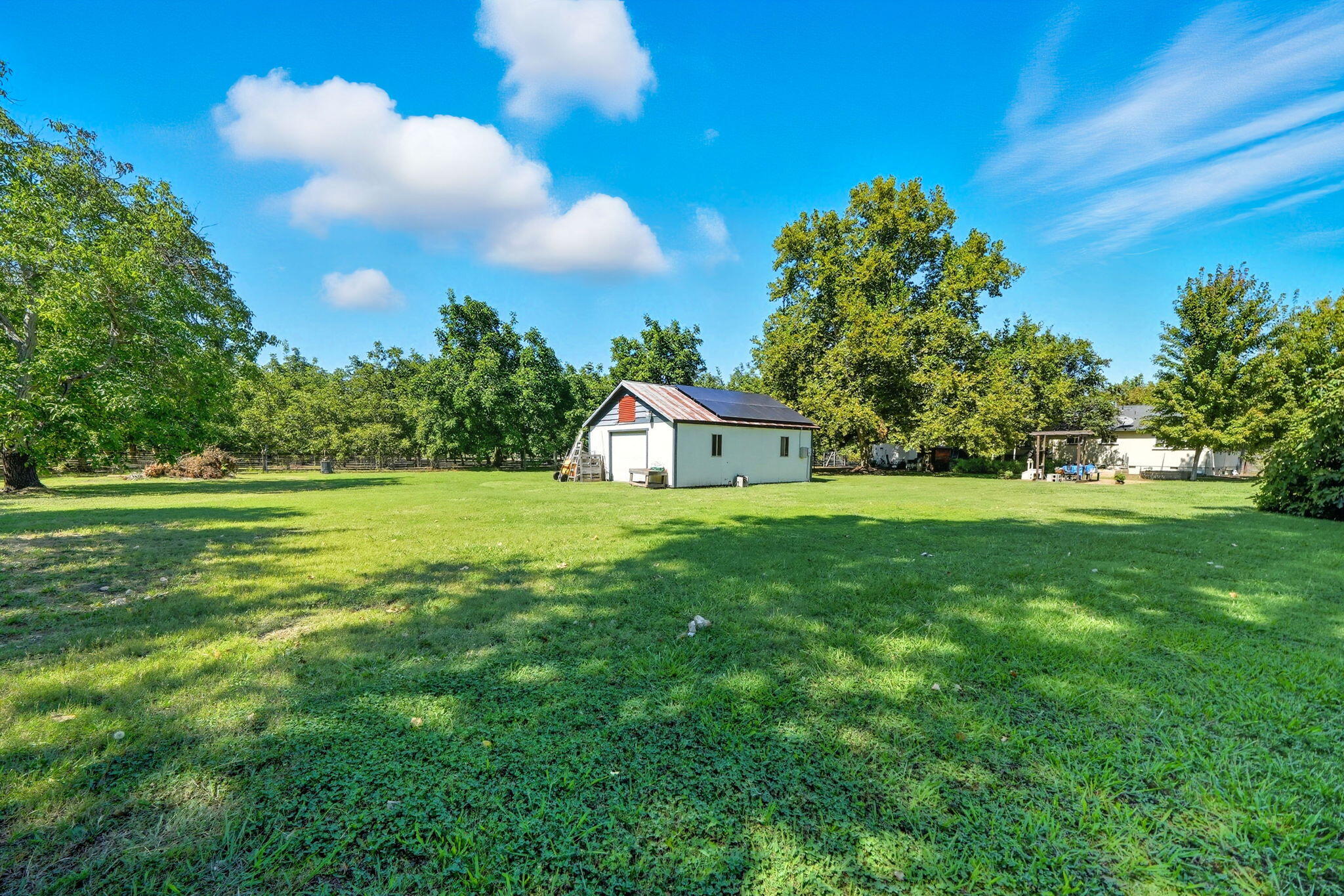 25031 Kauffman Avenue Red Bluff, CA 96080 - Photo 36 of 57 Back yard w/shop & solar