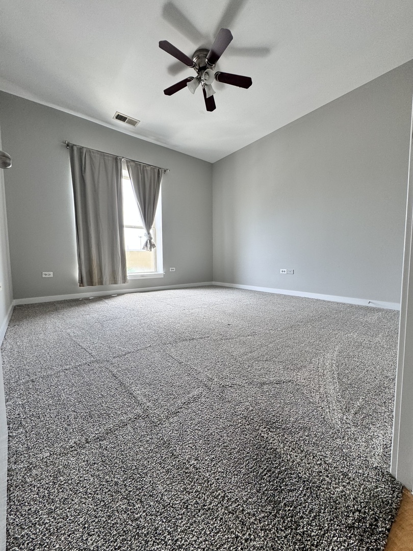 1075 West Roosevelt Road, Unit 305 Chicago, IL 60608 - Photo 15 of 23 a view of empty room with windows