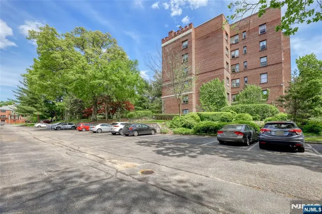 a view of a cars parked in front of a building