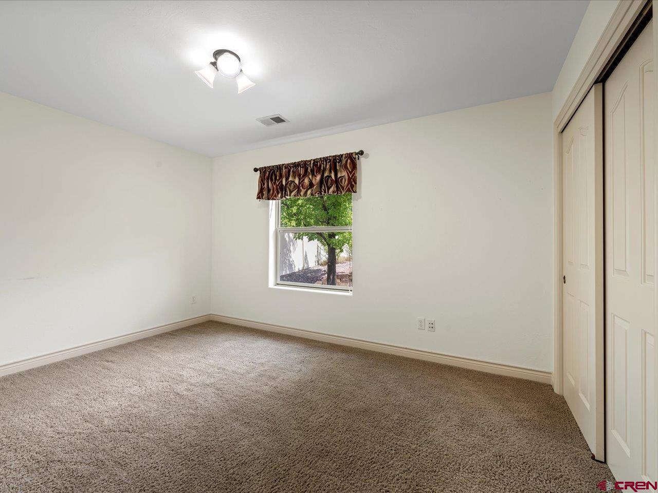 2001 Constitution Loop Montrose, CO 81401 - Photo 32 of 40 an empty room with windows