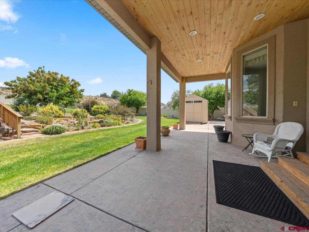 2001 Constitution Loop Montrose, CO 81401 - Photo 38 of 40 a balcony with table and chairs and garden