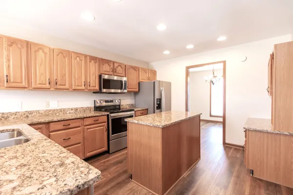 a view of small space with wooden floor and closet