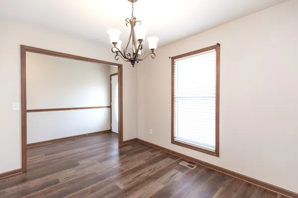 a kitchen with stainless steel appliances granite countertop a sink stove microwave and refrigerator