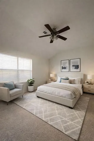 a spacious bedroom with a bed and furniture