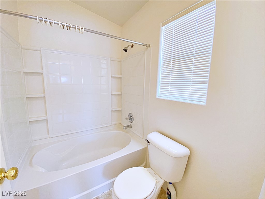 9335 Indian Corn Court, Unit 101 Las Vegas, NV 89178 - Photo 12 of 18 Bathroom featuring bathing tub / shower combination and toilet