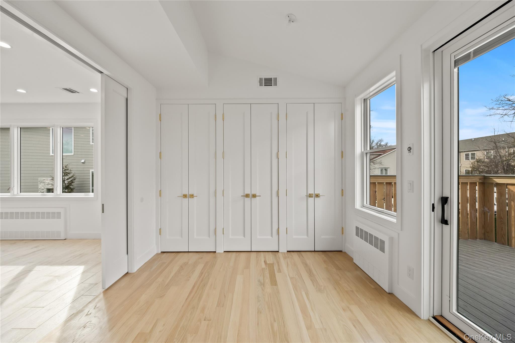 23 Singer Avenue, Unit 211 Spring Valley, NY 10977 - Photo 20 of 45 a view of a hallway with wooden floor and windows