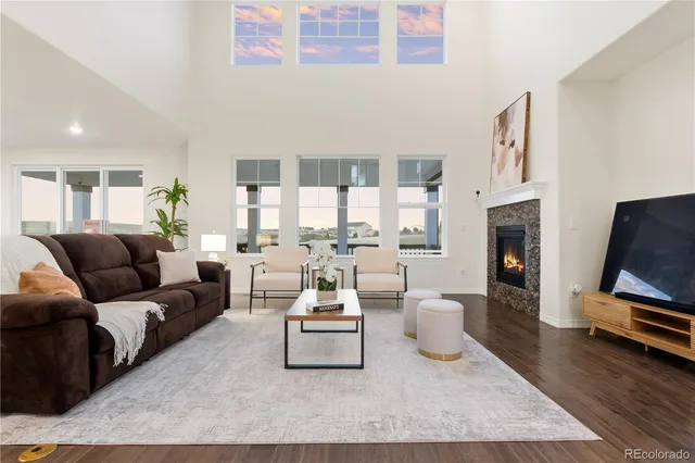 a kitchen with stainless steel appliances granite countertop a stove refrigerator a sink dishwasher and wooden cabinets