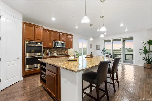 a spacious bathroom with a granite countertop tub sink and mirror