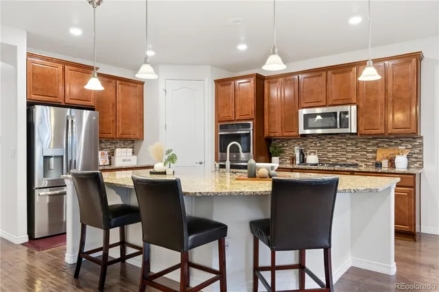 a bathroom with a tub sink shower and mirror