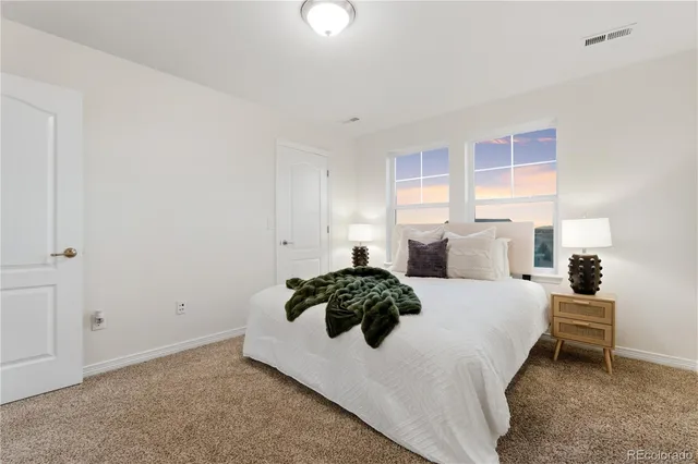 a bathroom with a granite countertop sink double and mirror