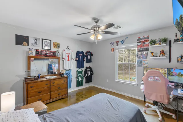 a bed room with a bed and a window