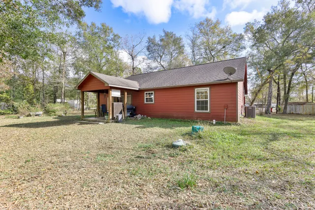 a backyard of a house with lots of green space