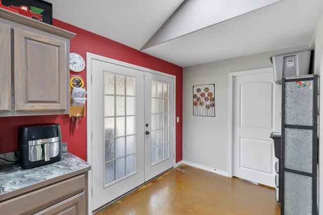 a view of an entryway with wooden floor