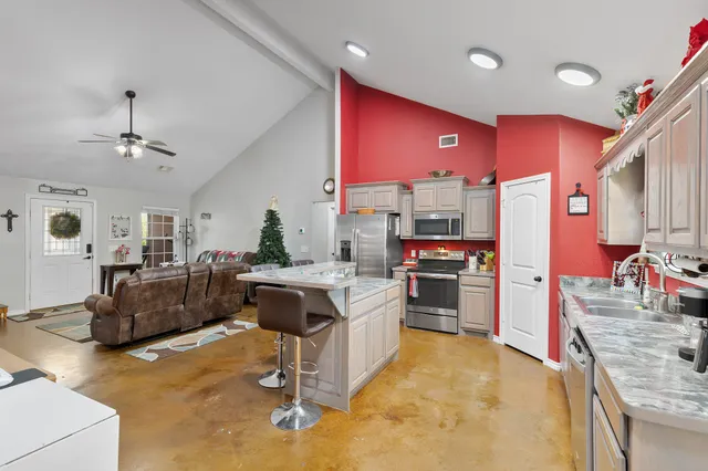 a kitchen with a stove a refrigerator and a stove