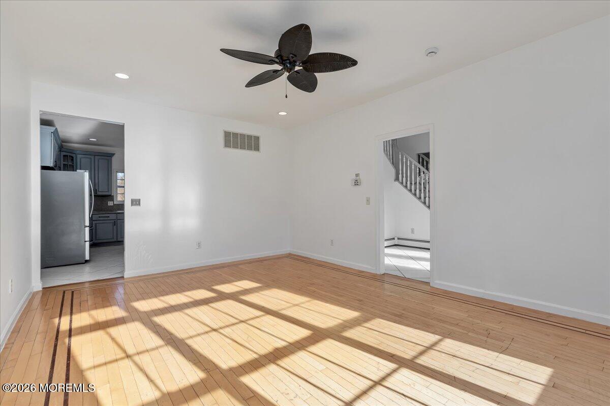 257 Ford Road Howell, NJ 07731 - Photo 20 of 45 a view of empty room with wooden floor and window
