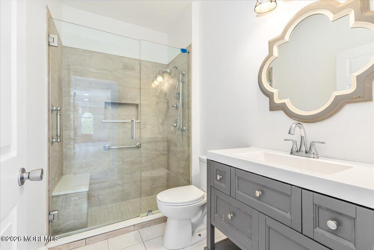 257 Ford Road Howell, NJ 07731 - Photo 21 of 45 a bathroom with a sink a toilet and shower