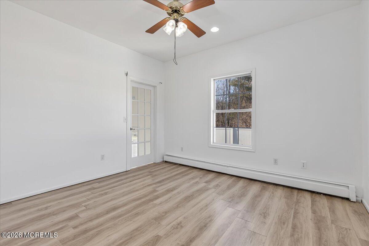 257 Ford Road Howell, NJ 07731 - Photo 22 of 45 wooden floor in an empty room with a window