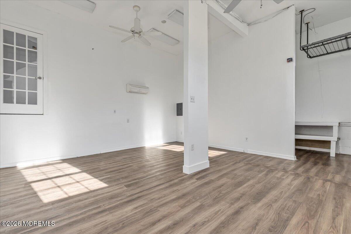 257 Ford Road Howell, NJ 07731 - Photo 25 of 45 a view of an empty room with wooden floor and a window