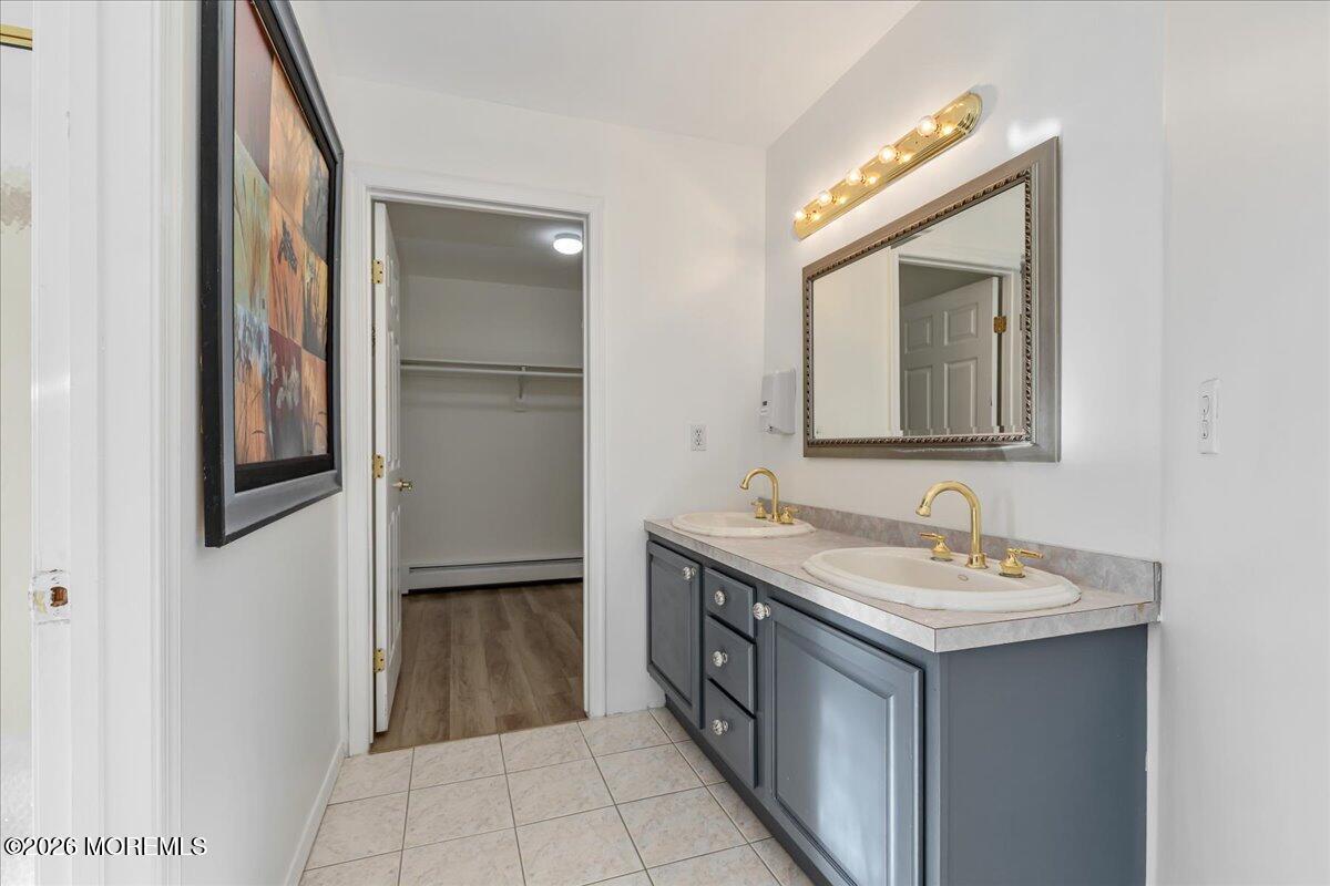 257 Ford Road Howell, NJ 07731 - Photo 29 of 45 a bathroom with a double vanity sink and a mirror