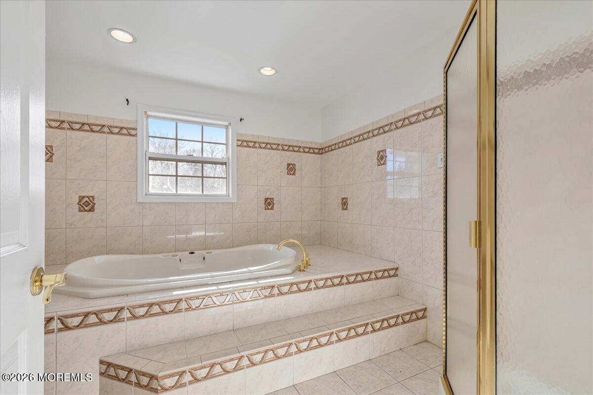 257 Ford Road Howell, NJ 07731 - Photo 30 of 45 a spacious bathroom with a tub shower and sink