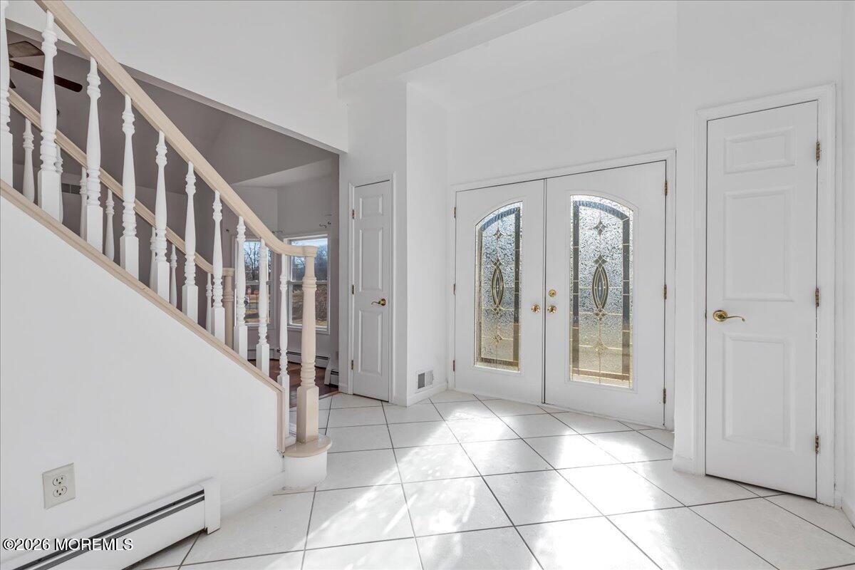 257 Ford Road Howell, NJ 07731 - Photo 3 of 45 a view of an entryway with staircase