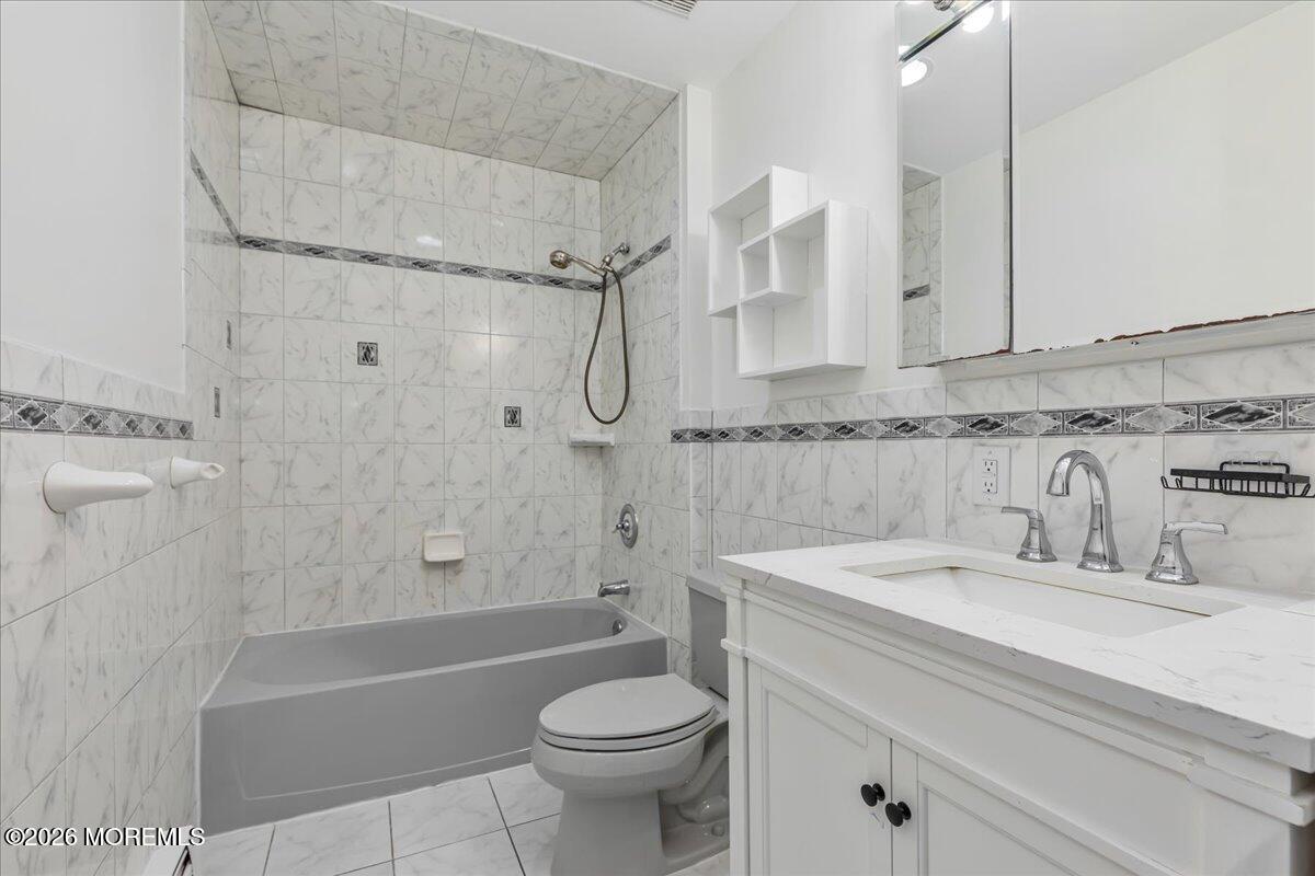 257 Ford Road Howell, NJ 07731 - Photo 34 of 45 a bathroom with a sink a toilet and shower