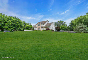 257 Ford Road Howell, NJ 07731 - Photo 40 of 45 a view of a green field with some trees in the background