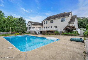 257 Ford Road Howell, NJ 07731 - Photo 42 of 45 a view of a swimming pool with a patio