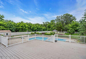 257 Ford Road Howell, NJ 07731 - Photo 43 of 45 a view of a roof deck with wooden fence and floor