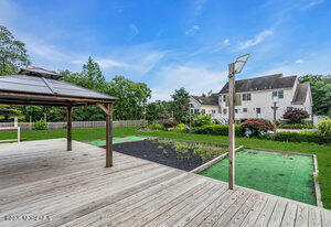 257 Ford Road Howell, NJ 07731 - Photo 45 of 45 a house view with a garden space